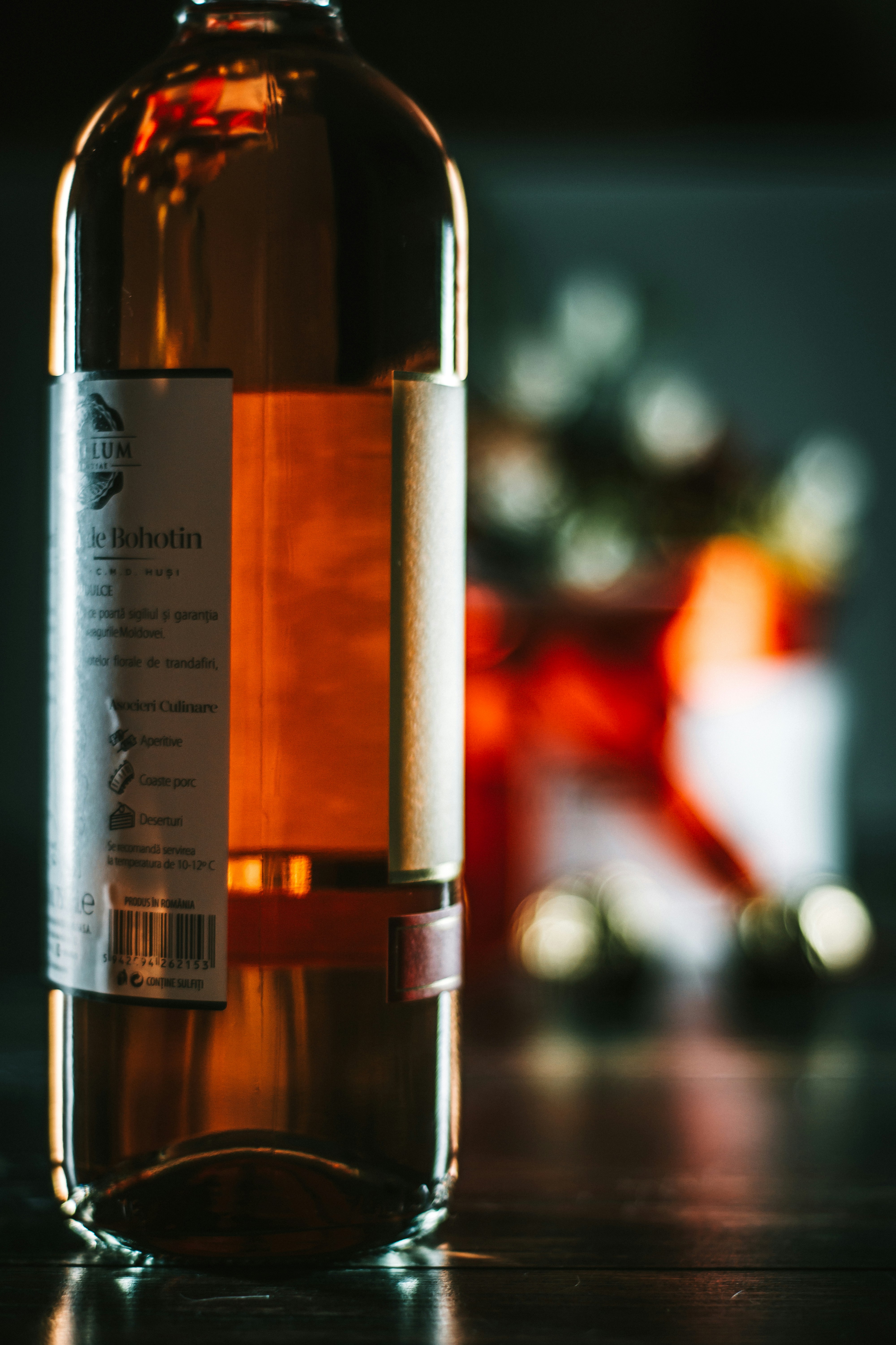 white labeled bottle on brown wooden table