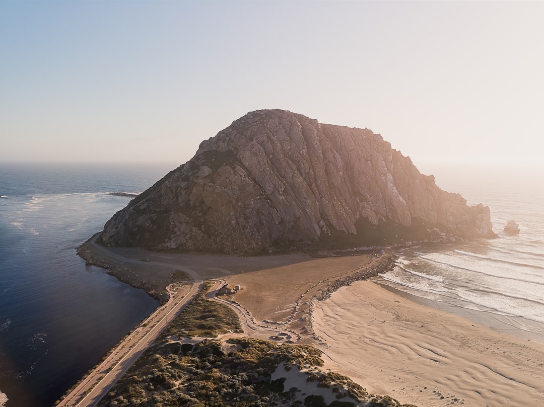 brown rock formation on sea shore during daytime