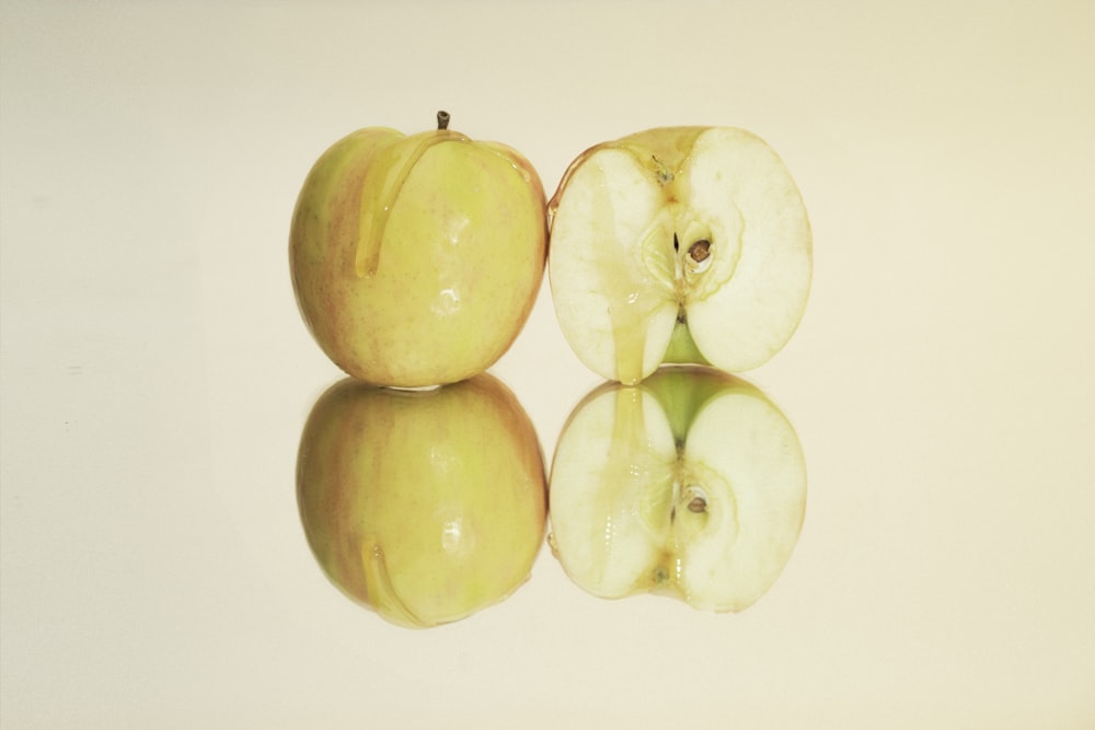 yellow round fruits on white surface