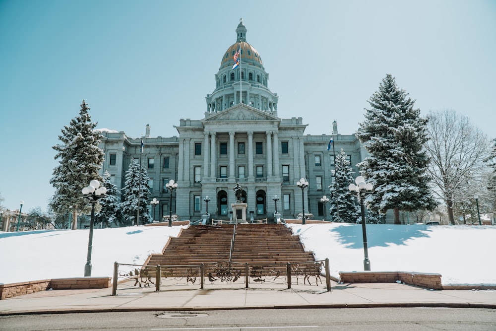 a very large building with a lot of snow on the ground