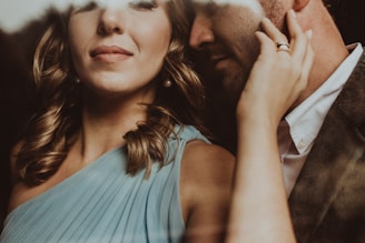 An artistic shot of a couple during a romantic photoshoot.