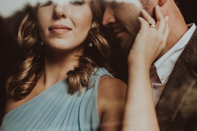 An artistic shot of a couple during a romantic photoshoot.