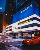 cars parked in front of building during night time