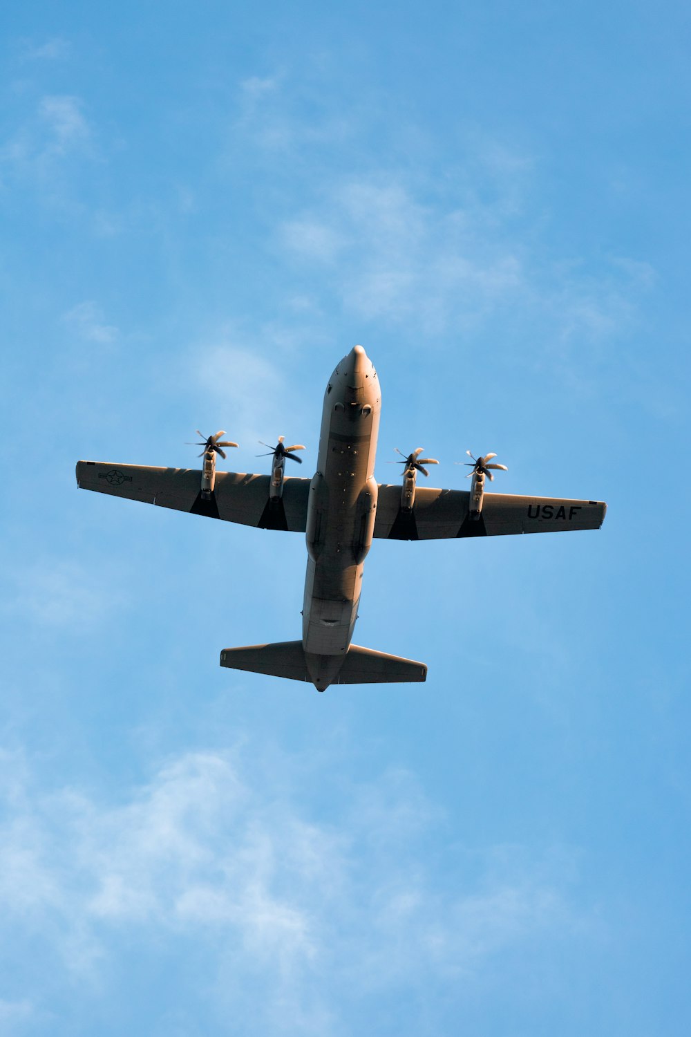 black jet plane in mid air during daytime