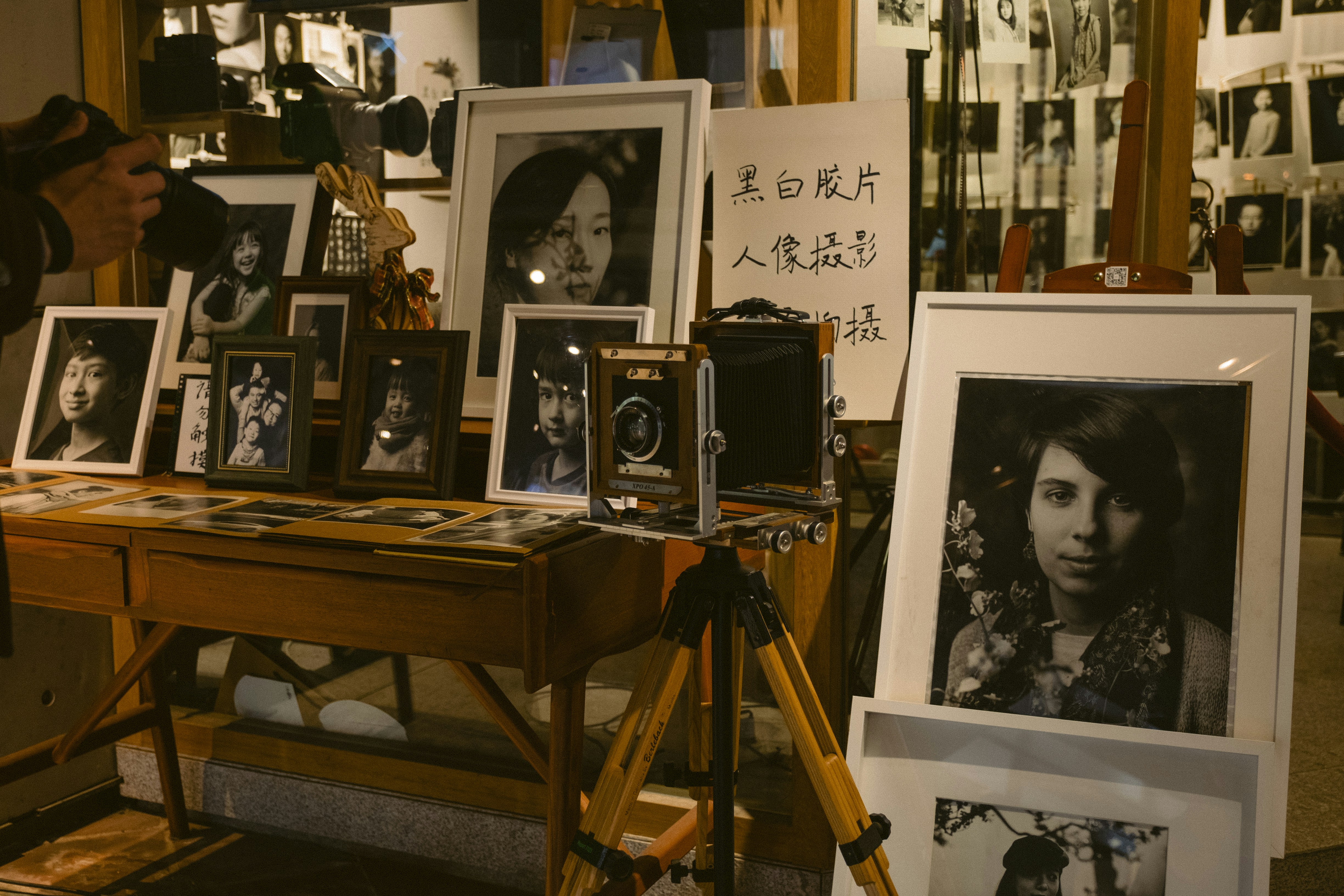 Vintage camera with old photographs being enhanced digitally