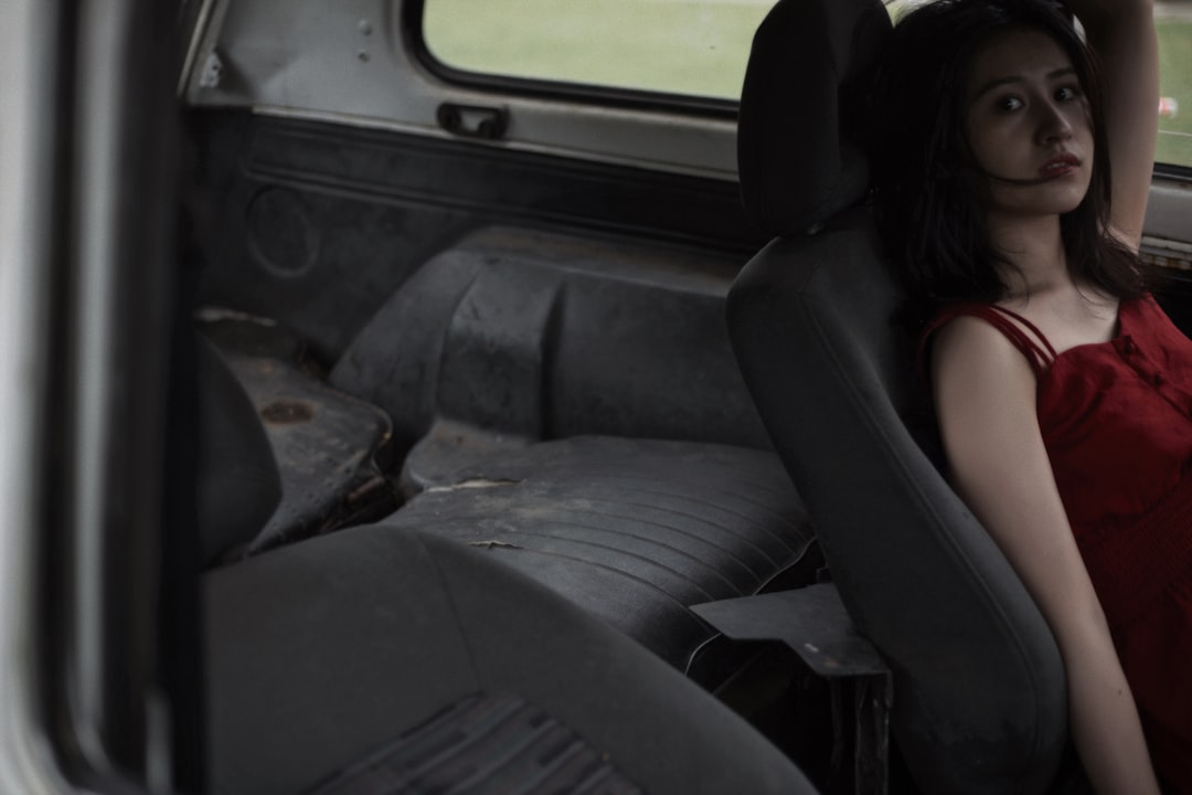 woman in black shirt sitting on car seat