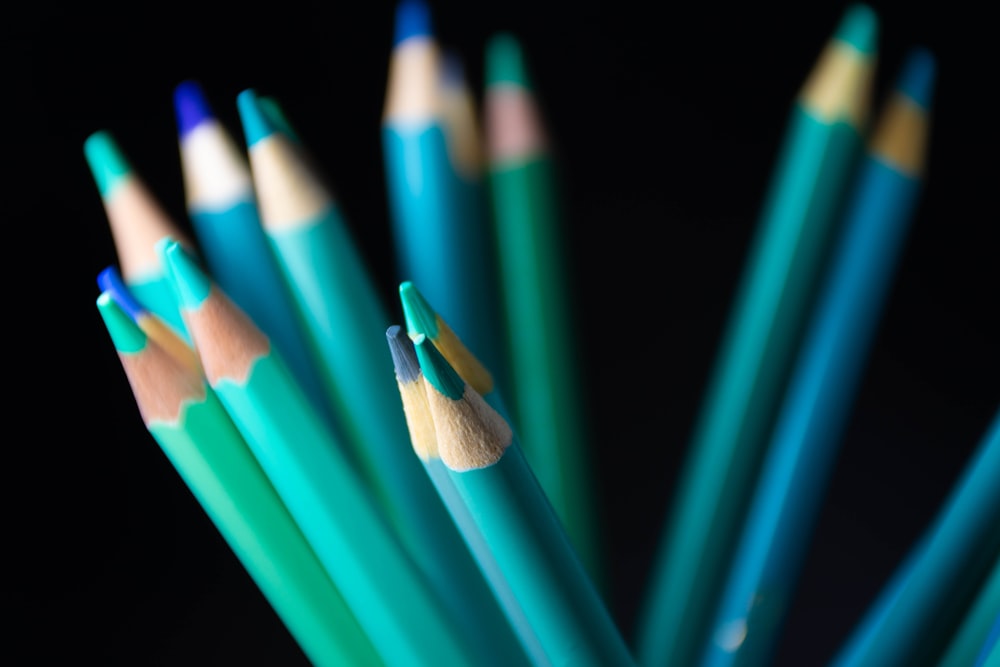 green color pencil in close up photography