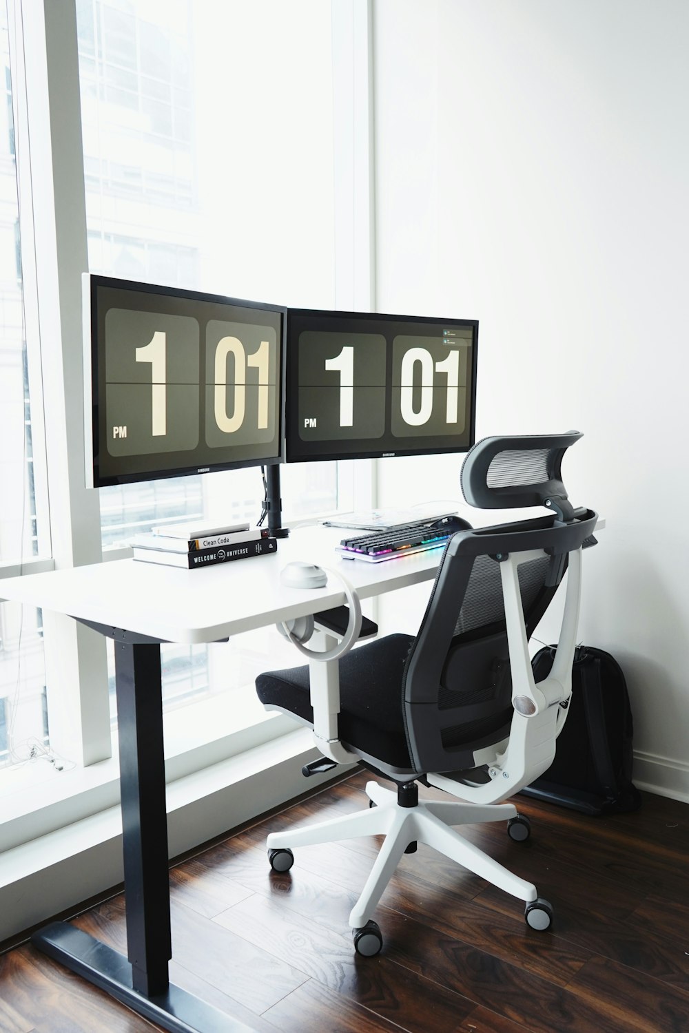 black and silver office rolling chair beside white table