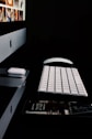 silver imac beside apple magic mouse and keyboard