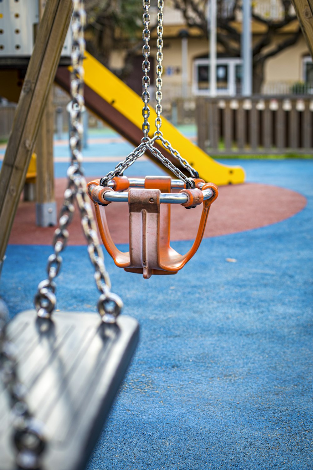 brown and black swing on blue and brown ground