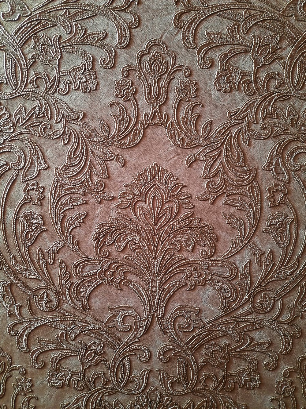 brown and white floral textile