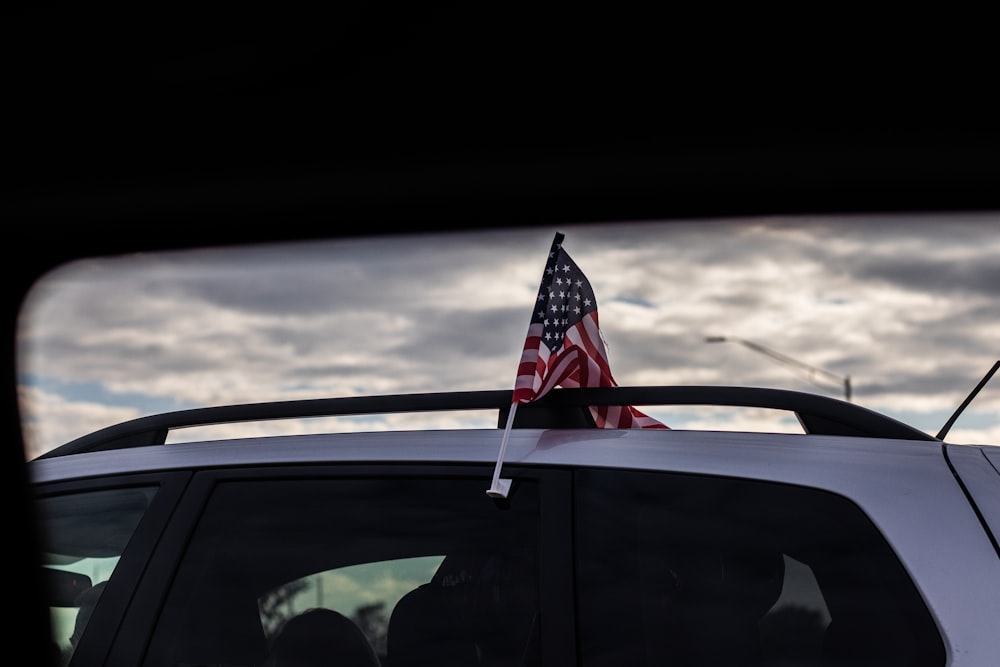 us a flag on car window