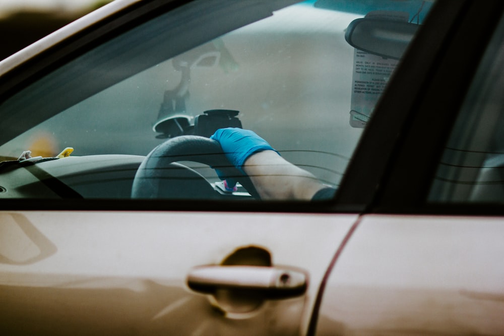 person driving car during daytime