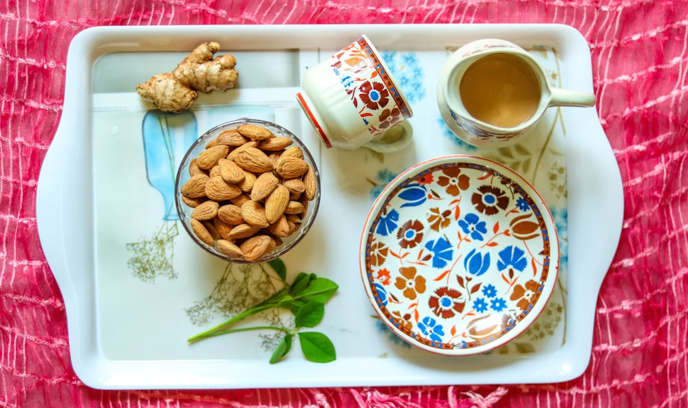brown cookies on white and blue floral ceramic plate