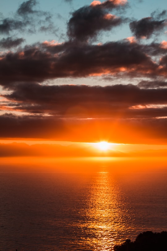 body of water under cloudy sky during sunset in False Bay South Africa