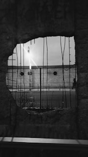 Image showing careful core drilling in a concrete wall inside a renovation site.