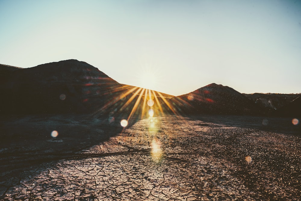 sun rays coming through mountain