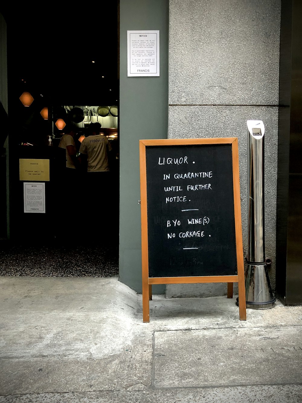 brown wooden framed black and yellow chalk board