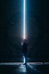 man in black jacket standing in tunnel