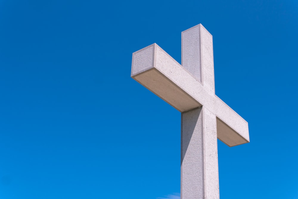 white cross under blue sky during daytime