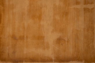 brown wooden floor with white textile