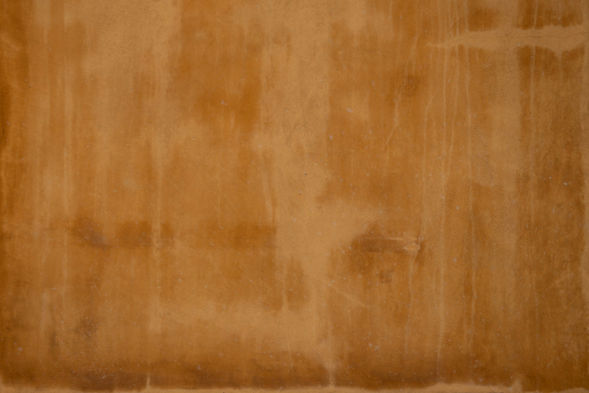 brown wooden floor with white textile