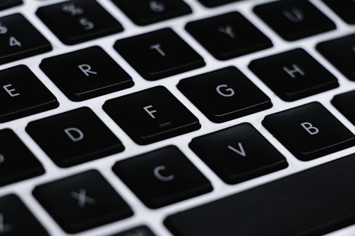 A user focused on typing practice with highlighted home row keys on a virtual keyboard.