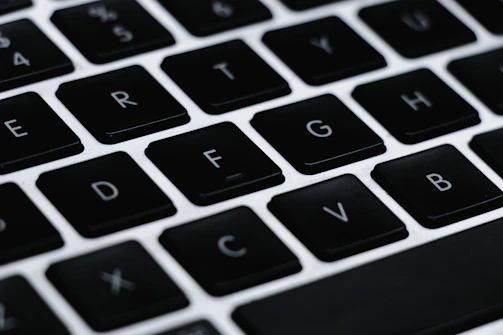 A player concentrating on a typing game with mixed letters, numbers, and symbols.