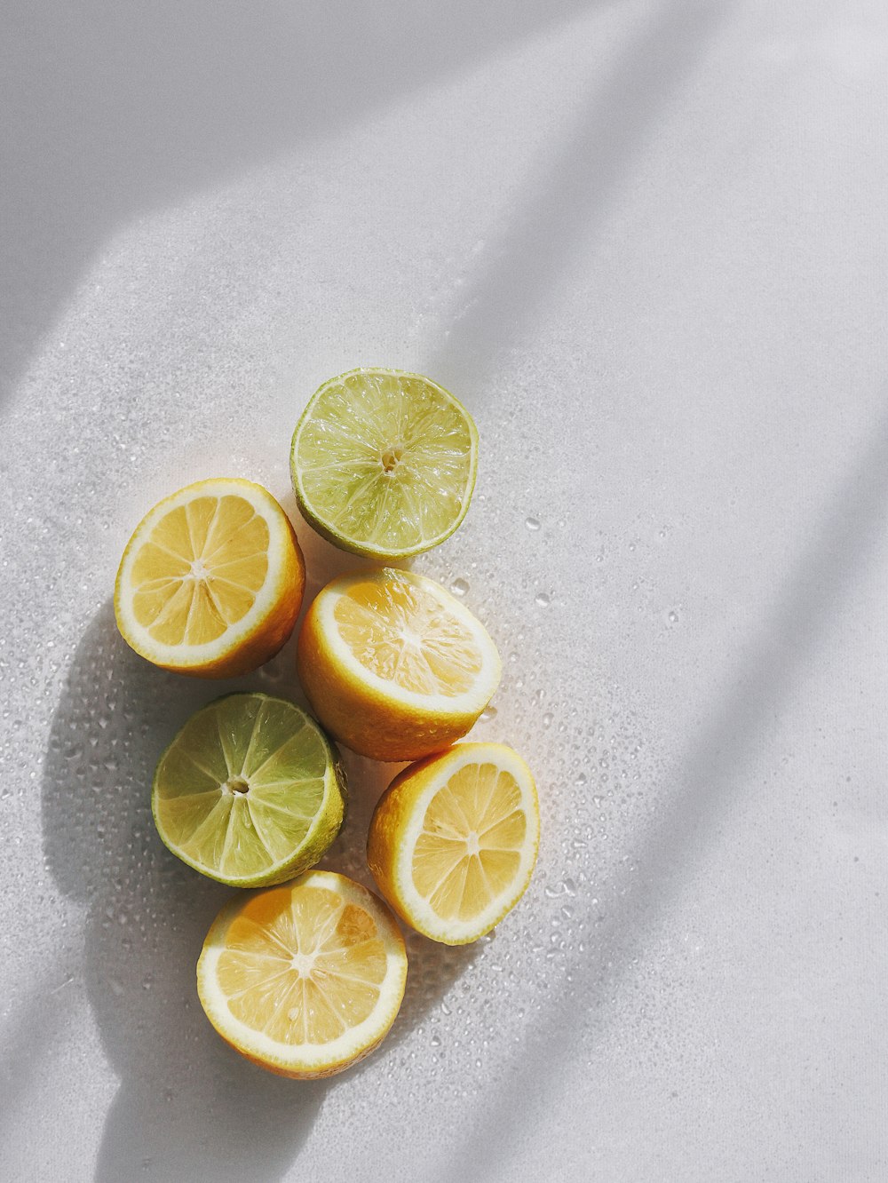 sliced lemon on white table