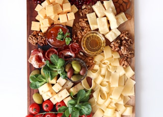 sliced vegetables on brown wooden chopping board