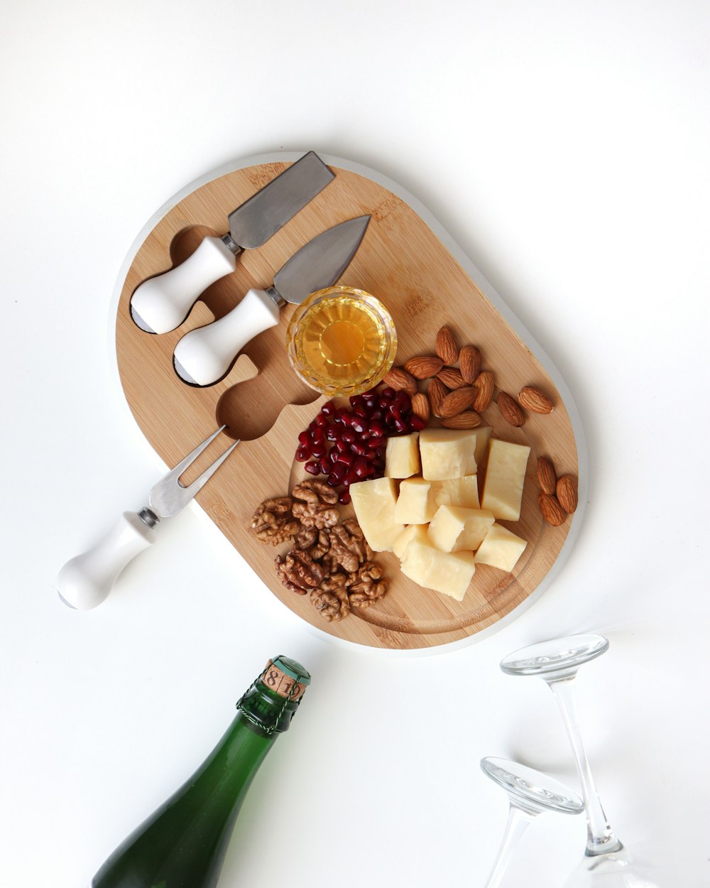 sliced apple and sliced apple on brown wooden chopping board