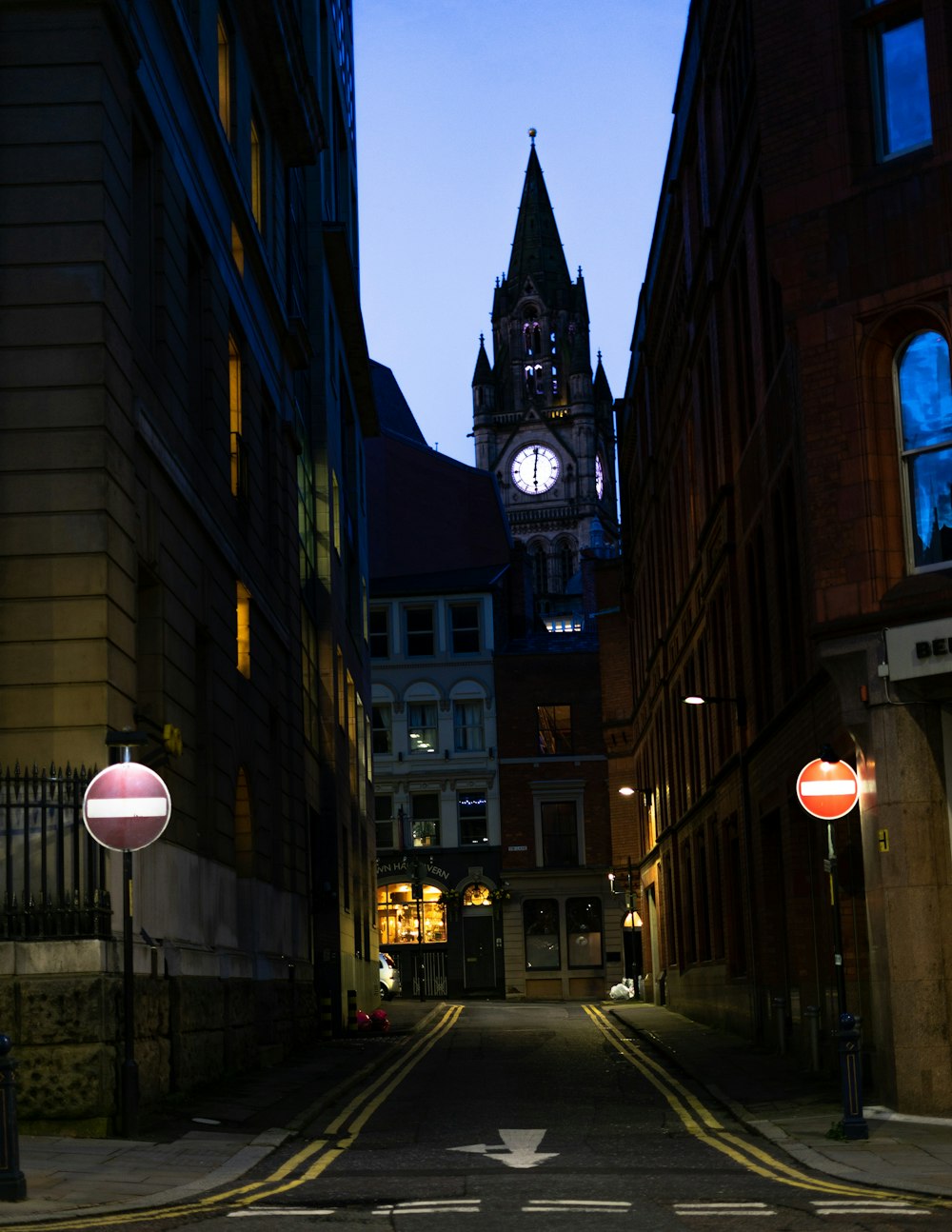 street light near brown building during night time