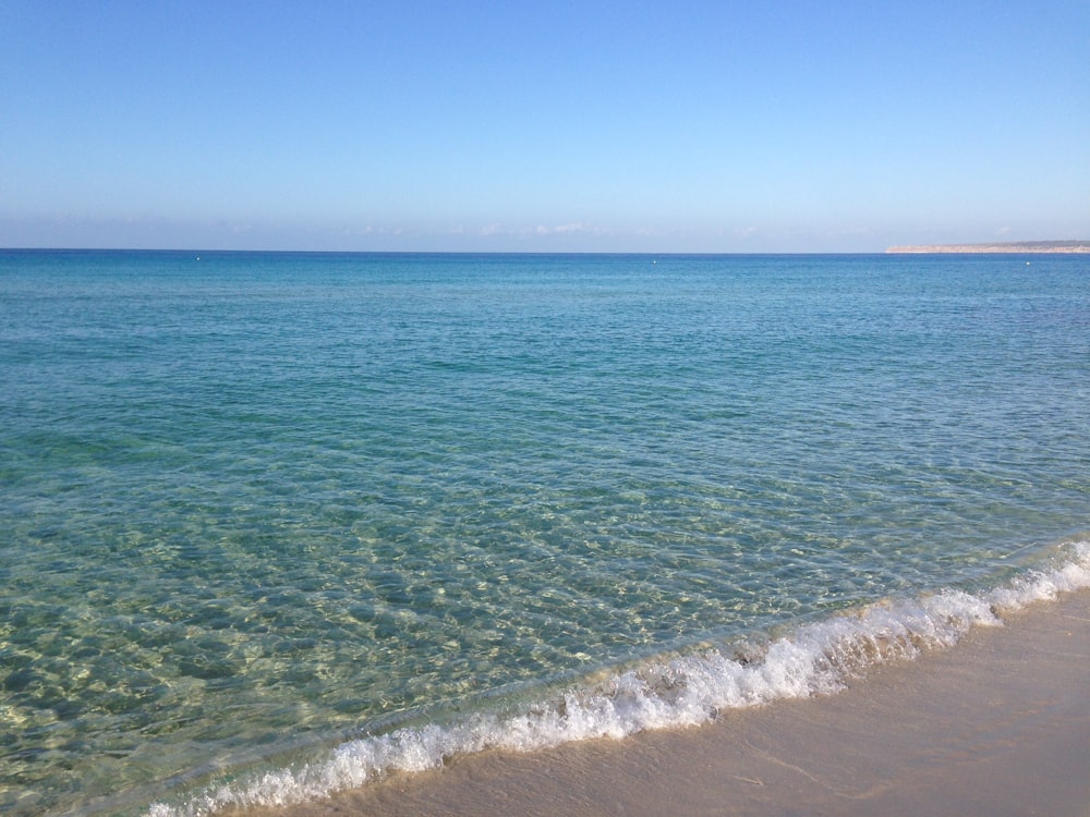 blue sea under blue sky during daytime