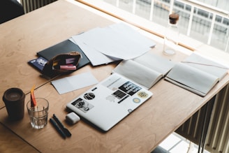 macbook pro on brown wooden table