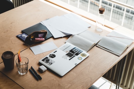 macbook pro on brown wooden table