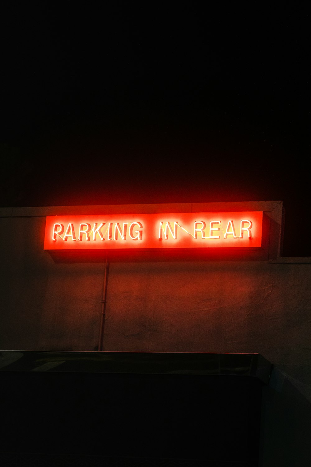 red and white UNKs coffee neon signage