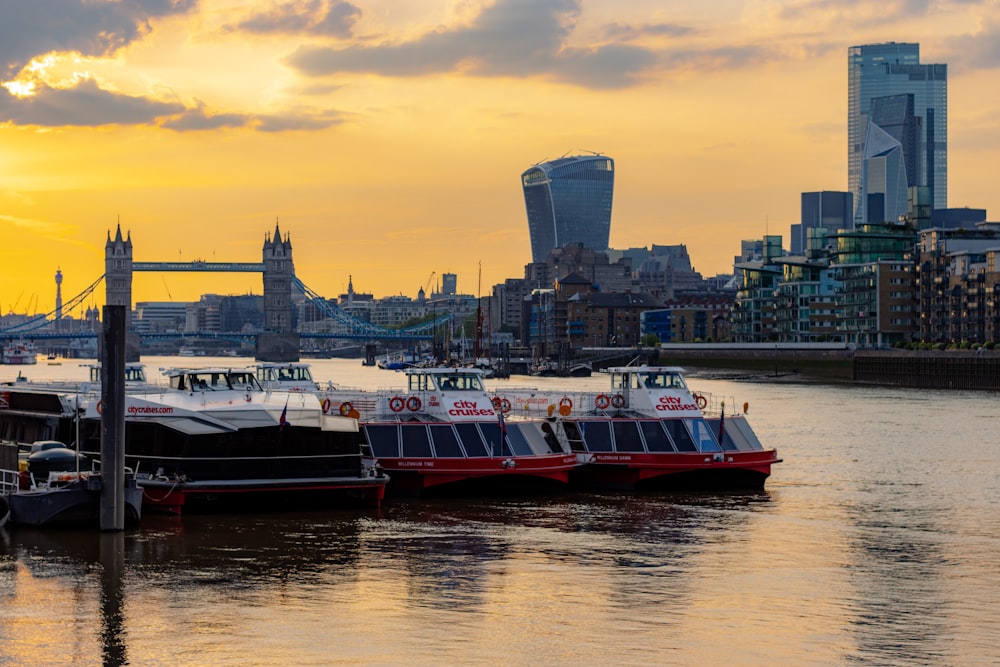 red and white boat on water near city buildings during daytime