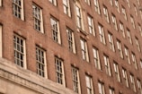 Wide shot of a residential building showing clean brick masonry work on the facade.