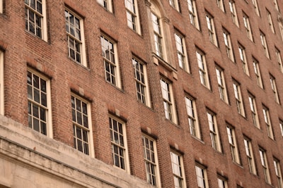Wide shot of a residential building showing clean brick masonry work on the facade.