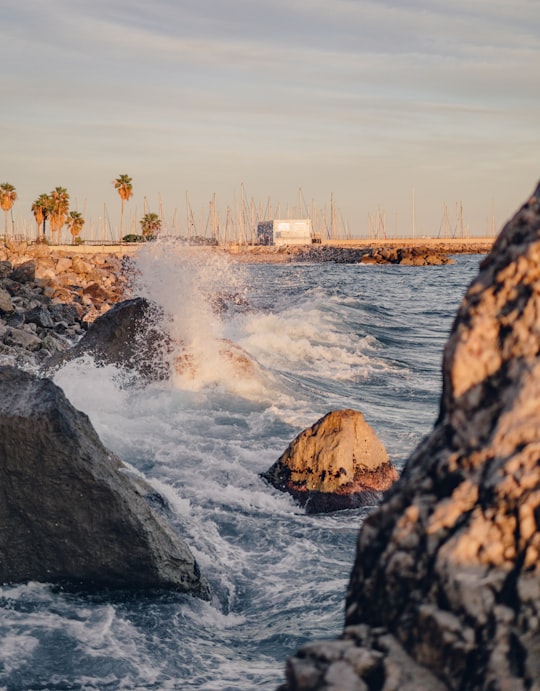 water falls on rocky shore during daytime in Garraf Spain