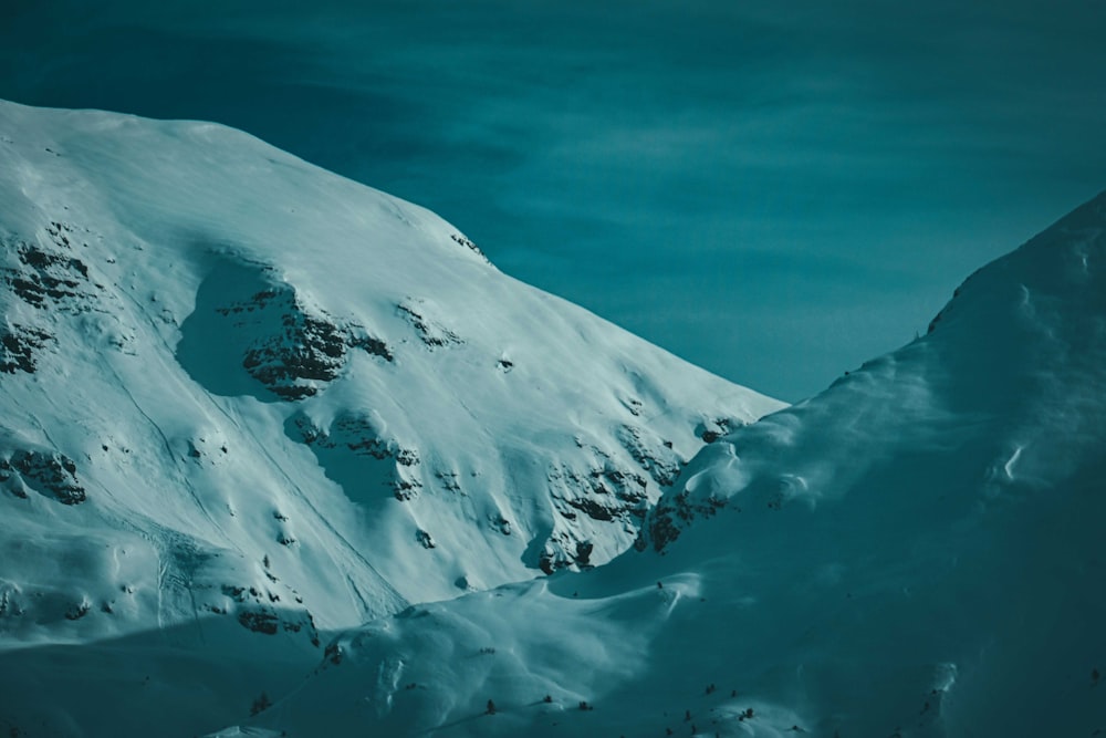 snow covered mountain under blue sky during daytime