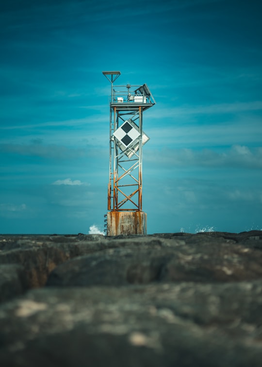 red and white tower under blue sky in Ocean City United States