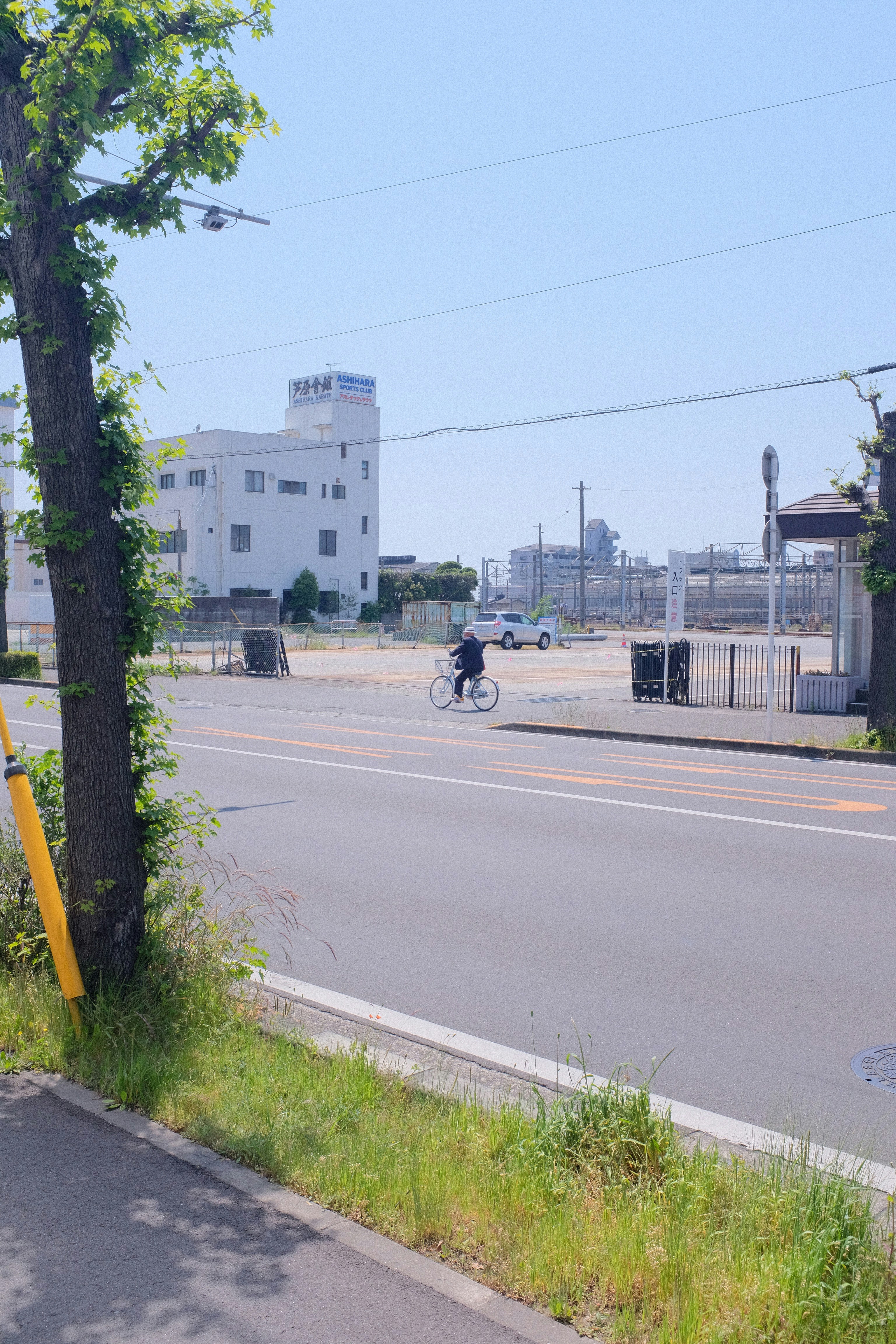 man in black jacket riding on black motorcycle on road during daytime