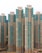 Tall residential skyscrapers with a modern design featuring a mix of teal and beige colors. The buildings have numerous windows and balconies, indicating high-density housing.