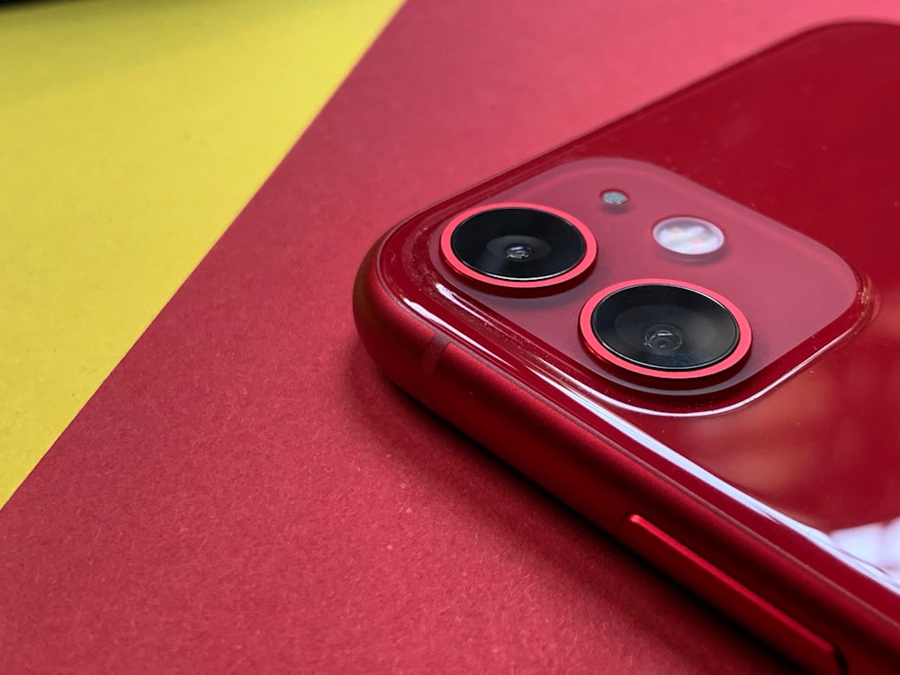 red and black device on red table