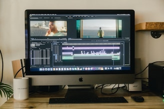 silver imac on brown wooden table
