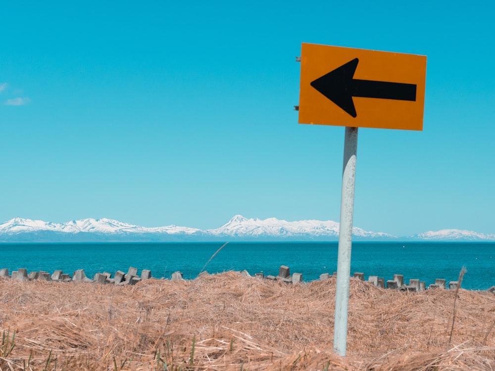 white and black arrow sign