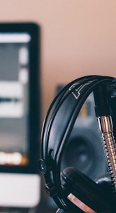 black and silver headphones on black and silver microphone