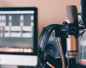 black and silver headphones on black and silver microphone