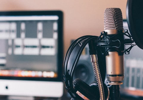 black and silver headphones on black and silver microphone